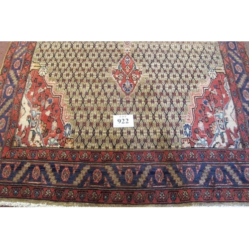 922 - A superb Persian carpet, central motif on a latticework ground with quarter spandrels. 317cm x 152cm... 