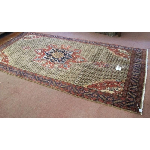 922 - A superb Persian carpet, central motif on a latticework ground with quarter spandrels. 317cm x 152cm... 