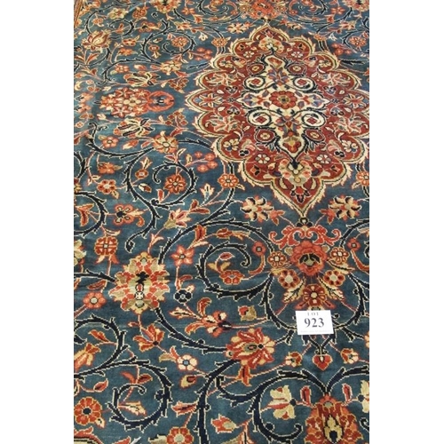 923 - A fine Persian Kashan carpet, central terracotta motif on blue ground. 420cm x 290cm.
Condition repo... 