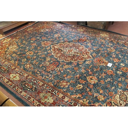 923 - A fine Persian Kashan carpet, central terracotta motif on blue ground. 420cm x 290cm.
Condition repo... 