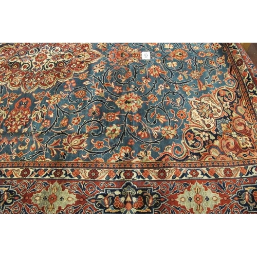 923 - A fine Persian Kashan carpet, central terracotta motif on blue ground. 420cm x 290cm.
Condition repo... 