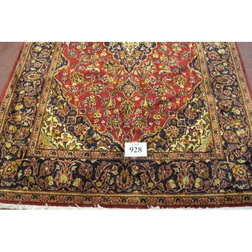 928 - A Persian rug Kashan, central motif on red ground with highly patterned border. 210cm x 140cm.
Condi... 