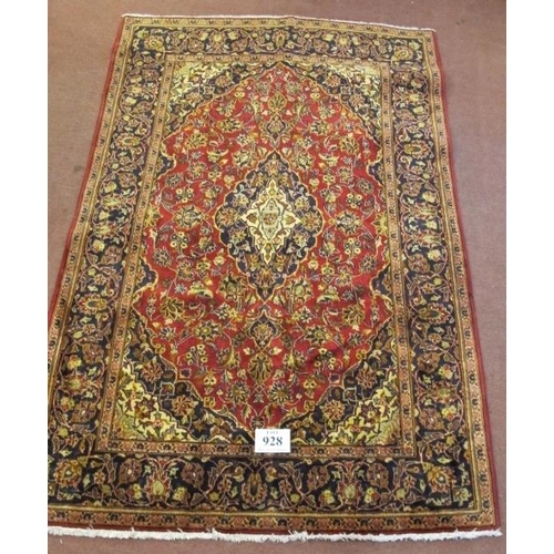 928 - A Persian rug Kashan, central motif on red ground with highly patterned border. 210cm x 140cm.
Condi... 