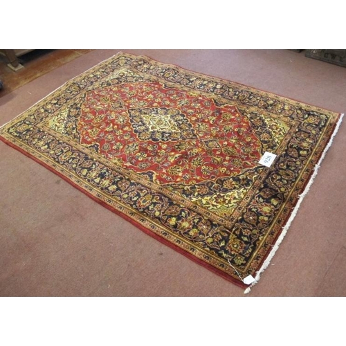 928 - A Persian rug Kashan, central motif on red ground with highly patterned border. 210cm x 140cm.
Condi... 