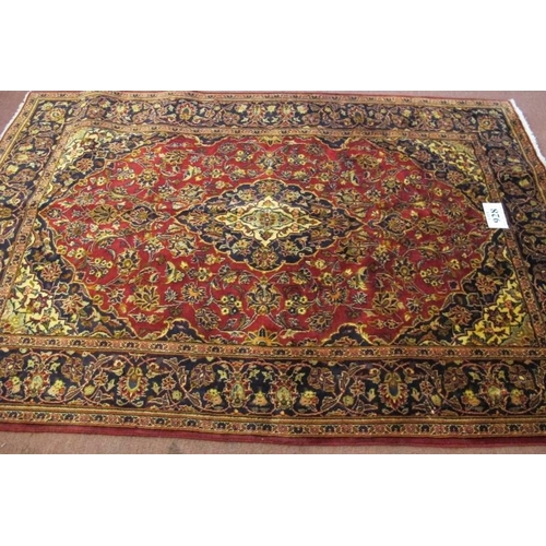 928 - A Persian rug Kashan, central motif on red ground with highly patterned border. 210cm x 140cm.
Condi... 