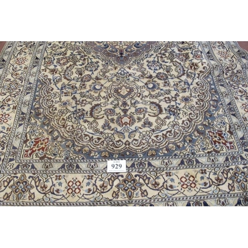 929 - A fine Persian Nain carpet, pale blue central motif on a highly patterned cream ground. 288cm x 200c... 