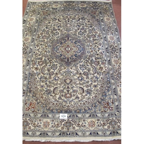 929 - A fine Persian Nain carpet, pale blue central motif on a highly patterned cream ground. 288cm x 200c... 