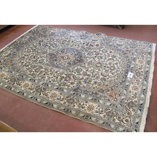 929 - A fine Persian Nain carpet, pale blue central motif on a highly patterned cream ground. 288cm x 200c... 