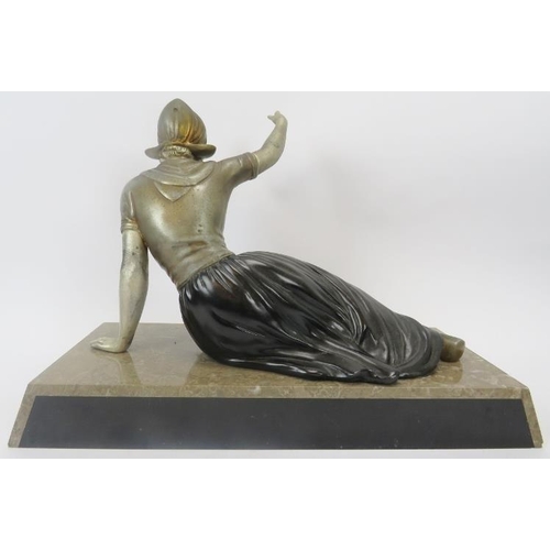 242 - A French Art Deco polychrome decorated spelter figure of a Dutch female. Mounted on a marble and aga... 