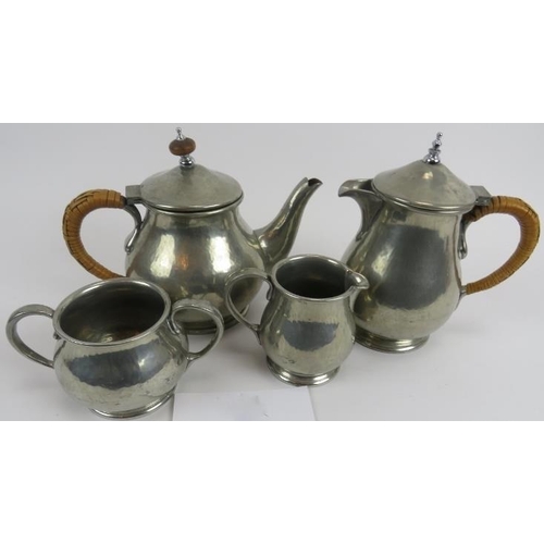 244 - Liberty and Co, English pewter 4 piece tea set, 1372. Hammered surface. Raffia handle to tea pot. Wa... 