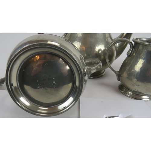 244 - Liberty and Co, English pewter 4 piece tea set, 1372. Hammered surface. Raffia handle to tea pot. Wa... 