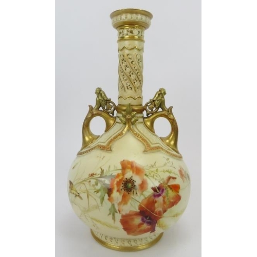 252 - A large Royal Worcester twin handled vase. With a pierced cylindrical neck, gilt handles and highlig... 