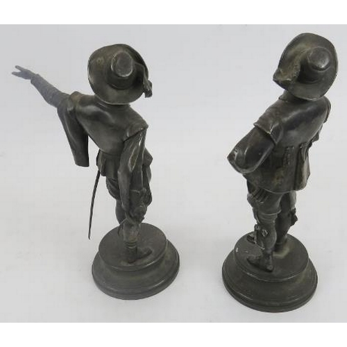 253 - After E. Guillemin (1841-1907) pair of silver plated bronze standing musketeers. Impressed name to c... 