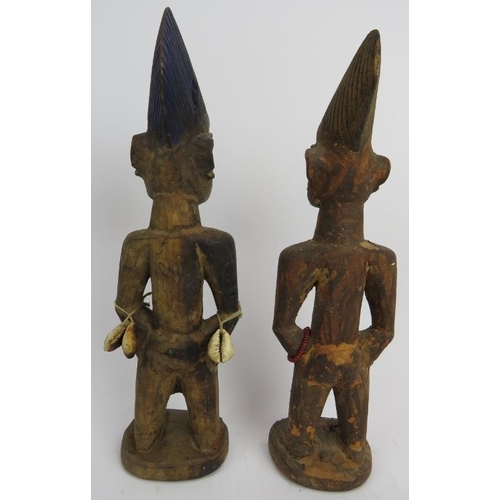 260 - Tribal Art: A pair of West African carved wood Ibeji Twins, Yoruba Tribe. Carved as a male and femal... 