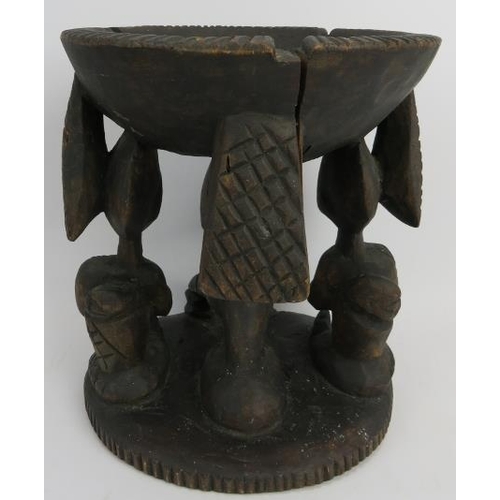 261 - Tribal Art: A Kola nut carved wood offering stand, Yoruba Tribe. Carved depicting three figures supp... 