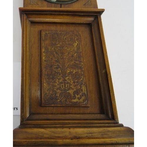 266 - Miniature long case clock, walnut, traces of gilding to etched panel, not tested, 18cm height. 
Cond... 