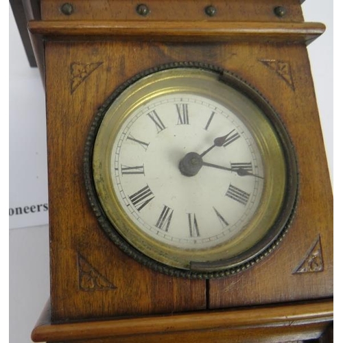 266 - Miniature long case clock, walnut, traces of gilding to etched panel, not tested, 18cm height. 
Cond... 