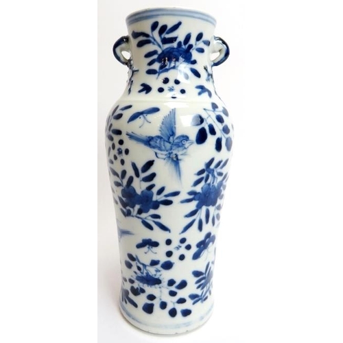 100 - A Chinese blue and white porcelain twin handled vase, 19th century. The twin handles with blossoming... 