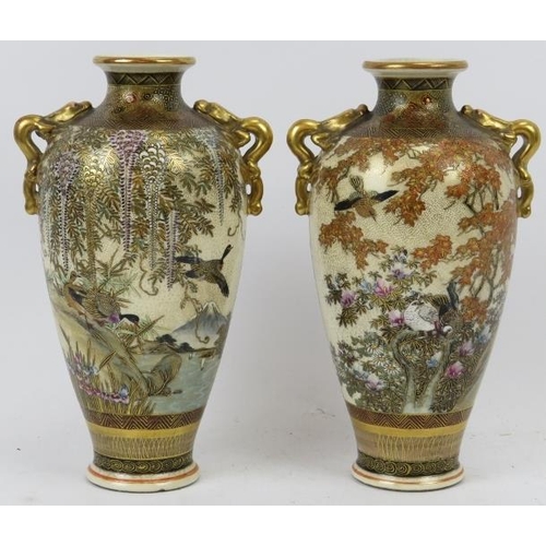 119 - A pair of Japanese Satsuma twin handled vases, Meiji period (1868 - 1912). With finely painted and g... 