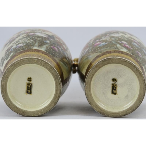 119 - A pair of Japanese Satsuma twin handled vases, Meiji period (1868 - 1912). With finely painted and g... 