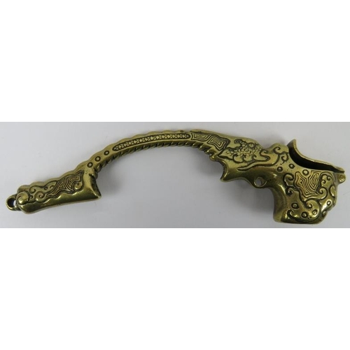 122 - A Chinese brass opium pipe, 19th century. Modelled with a scaled dragon grip handle, suspension ring... 