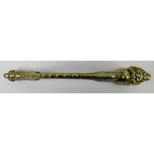 122 - A Chinese brass opium pipe, 19th century. Modelled with a scaled dragon grip handle, suspension ring... 