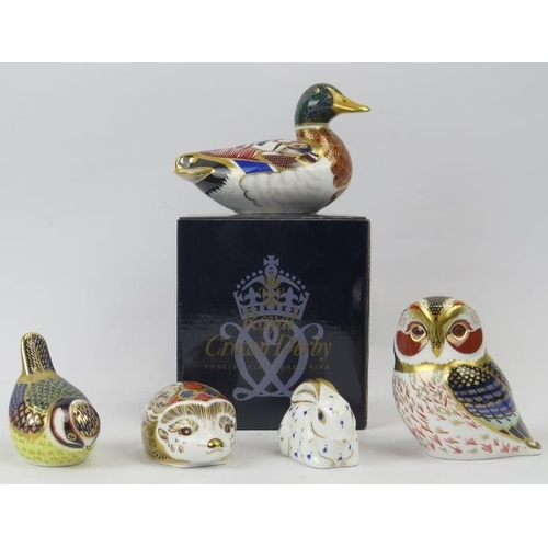 135 - A group of five Royal Crown Derby porcelain figurines. Comprising a Mallard duck with box, a blue ti... 