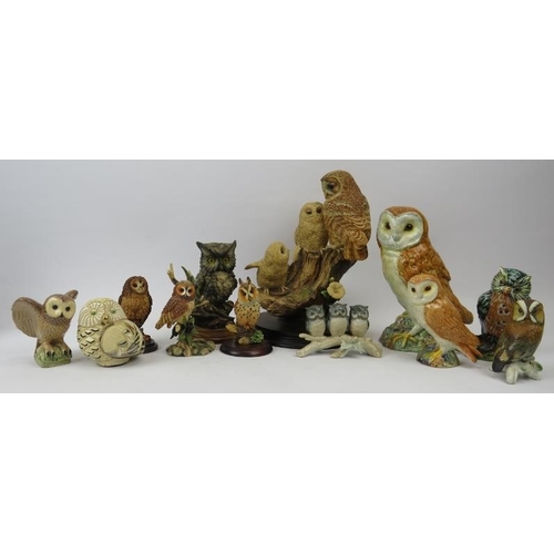 137 - A large collection of pottery and porcelain owl figurines. Notable makers include Beswick and Royal ... 