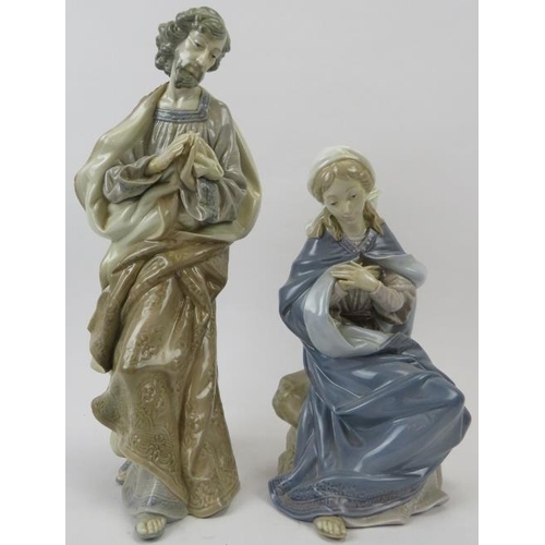 142 - Two large Lladro religious figurines. Comprising a standing depiction of Jesus and a seated depictio... 