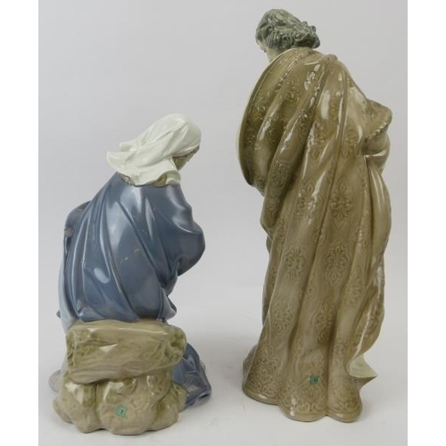 142 - Two large Lladro religious figurines. Comprising a standing depiction of Jesus and a seated depictio... 