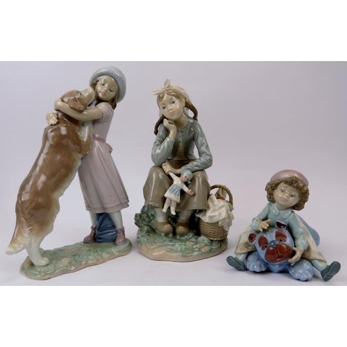 144 - A group of three Lladro figurines. Comprising ‘A Warm Welcome’ numbered 6903, ‘Giddy Up’ numbered 56... 