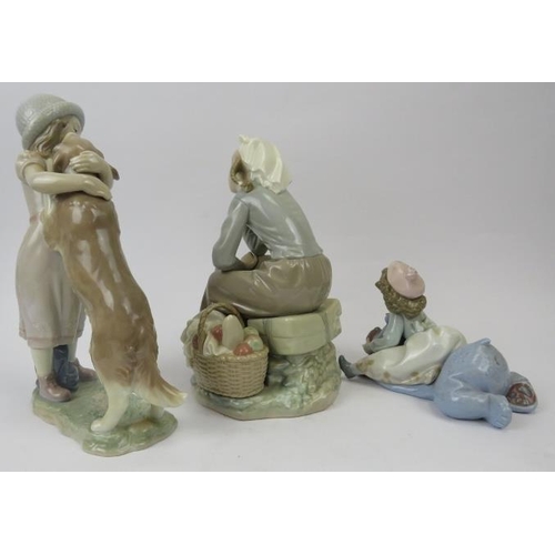 144 - A group of three Lladro figurines. Comprising ‘A Warm Welcome’ numbered 6903, ‘Giddy Up’ numbered 56... 