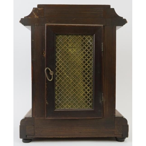 16 - A Victorian mahogany table clock, 19th century. With enamelled Roman numeral dial and supported on b... 