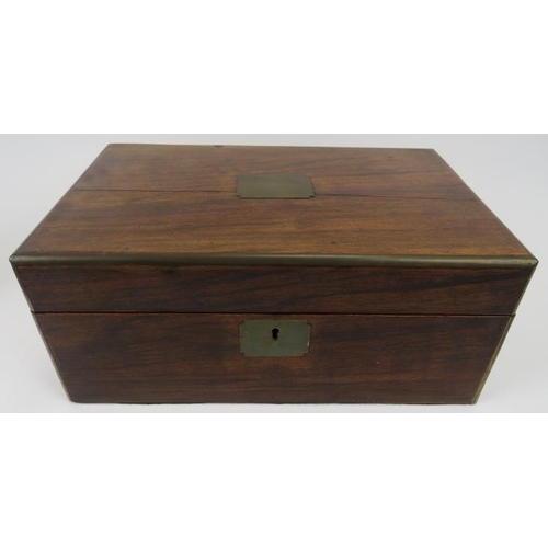 168 - A Victorian rosewood writing slope. Exterior with brass escutcheon and mounts. Fitted interior with ... 