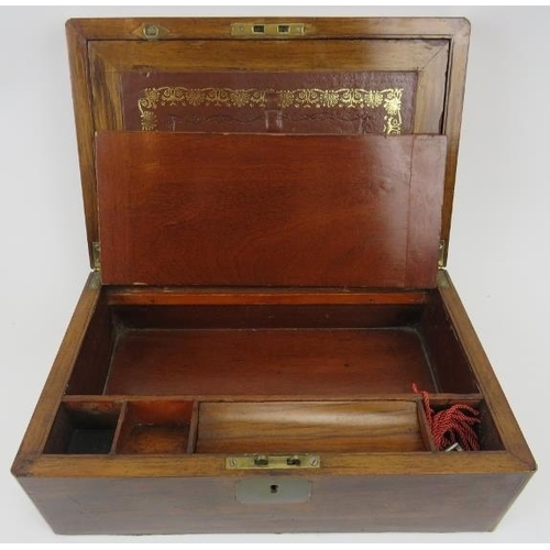 168 - A Victorian rosewood writing slope. Exterior with brass escutcheon and mounts. Fitted interior with ... 