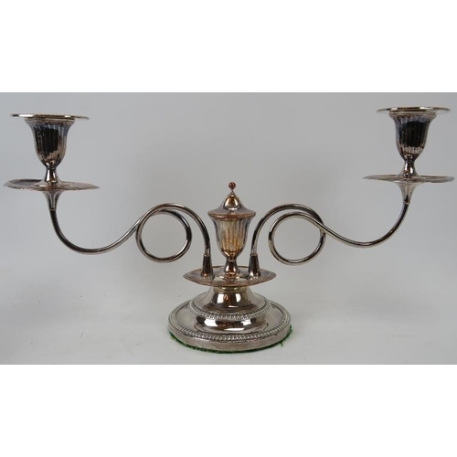 179 - An electroplated silver two branch candelabra, 19th century. With tendril stems. Detachable sconces ... 