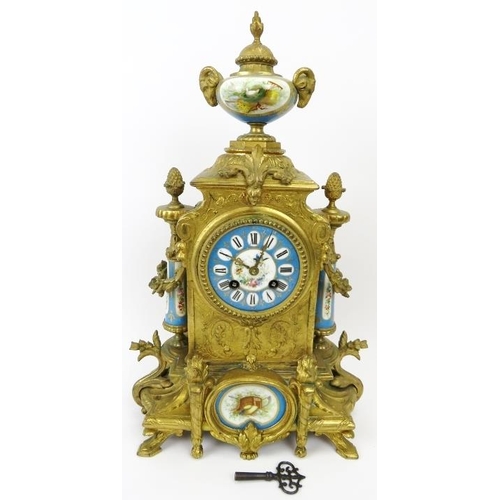 2 - A French ormolu and porcelain mantle clock, 19th century. Modelled in the Neoclassical style with ha... 