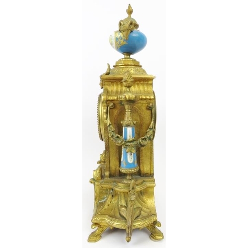 2 - A French ormolu and porcelain mantle clock, 19th century. Modelled in the Neoclassical style with ha... 