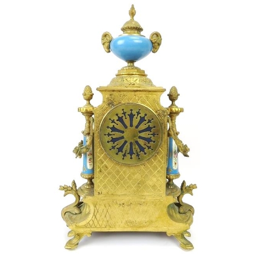 2 - A French ormolu and porcelain mantle clock, 19th century. Modelled in the Neoclassical style with ha... 