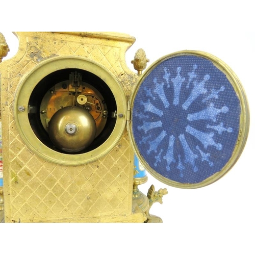 2 - A French ormolu and porcelain mantle clock, 19th century. Modelled in the Neoclassical style with ha... 