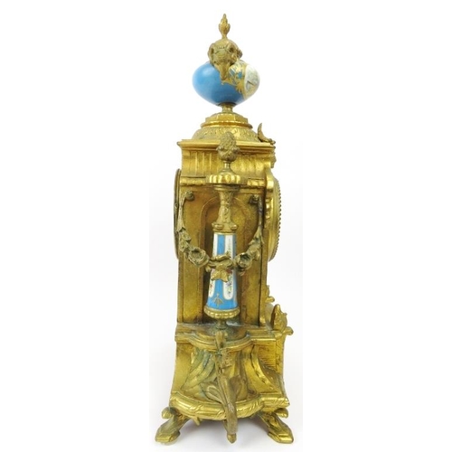 2 - A French ormolu and porcelain mantle clock, 19th century. Modelled in the Neoclassical style with ha... 