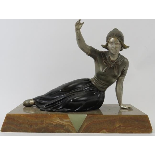 242 - A French Art Deco polychrome decorated spelter figure of a Dutch female. Mounted on a marble and aga... 