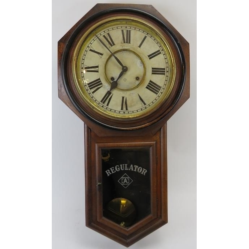 246 - American Ansonia drop dial wall clock, 19th century. The movement strikes on a gong. Key and pendulu... 