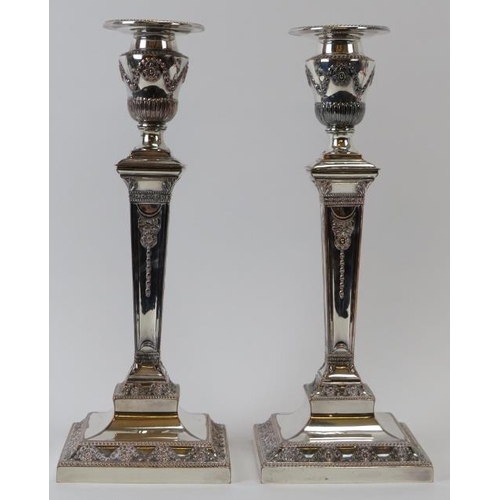 251 - A pair of good quality silver plated Adams revival candlesticks, 19th century. With weighted bases, ... 