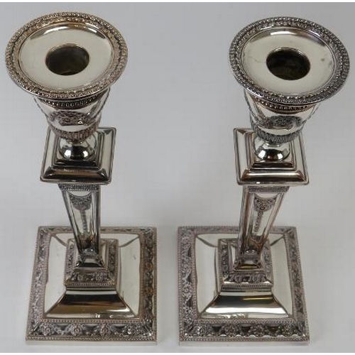 251 - A pair of good quality silver plated Adams revival candlesticks, 19th century. With weighted bases, ... 