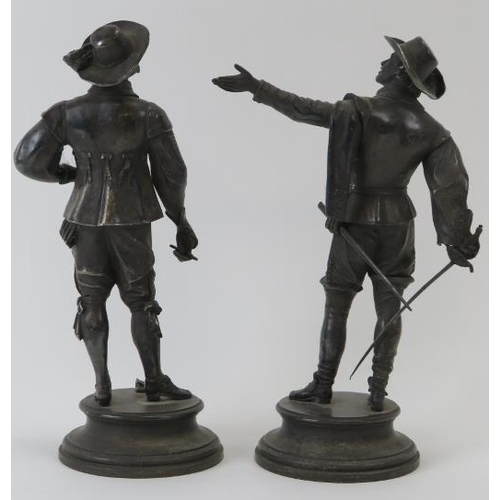 253 - After E. Guillemin (1841-1907) pair of silver plated bronze standing musketeers. Impressed name to c... 