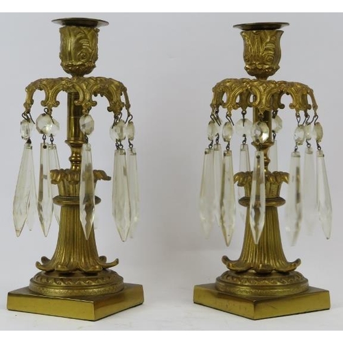 26 - A pair of French Empire style ormolu and crystal glass lustres, 19th century. Both with nine cut gla... 