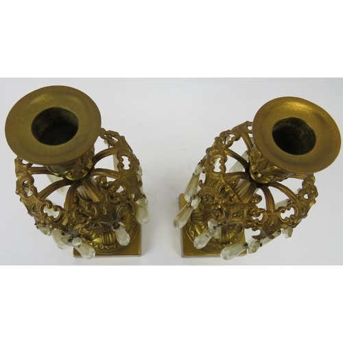 26 - A pair of French Empire style ormolu and crystal glass lustres, 19th century. Both with nine cut gla... 