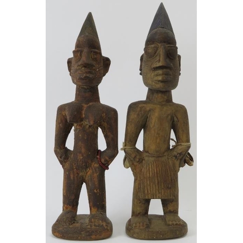 260 - Tribal Art: A pair of West African carved wood Ibeji Twins, Yoruba Tribe. Carved as a male and femal... 