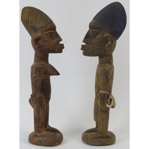 260 - Tribal Art: A pair of West African carved wood Ibeji Twins, Yoruba Tribe. Carved as a male and femal... 